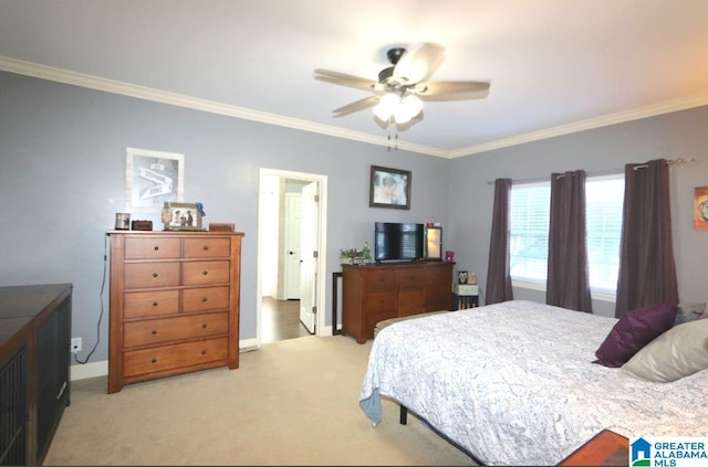 bedroom featuring ceiling fan, light colored carpet, and ornamental molding