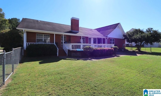 back of property featuring a yard and a wooden deck