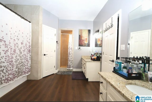 bathroom featuring hardwood / wood-style floors and vanity