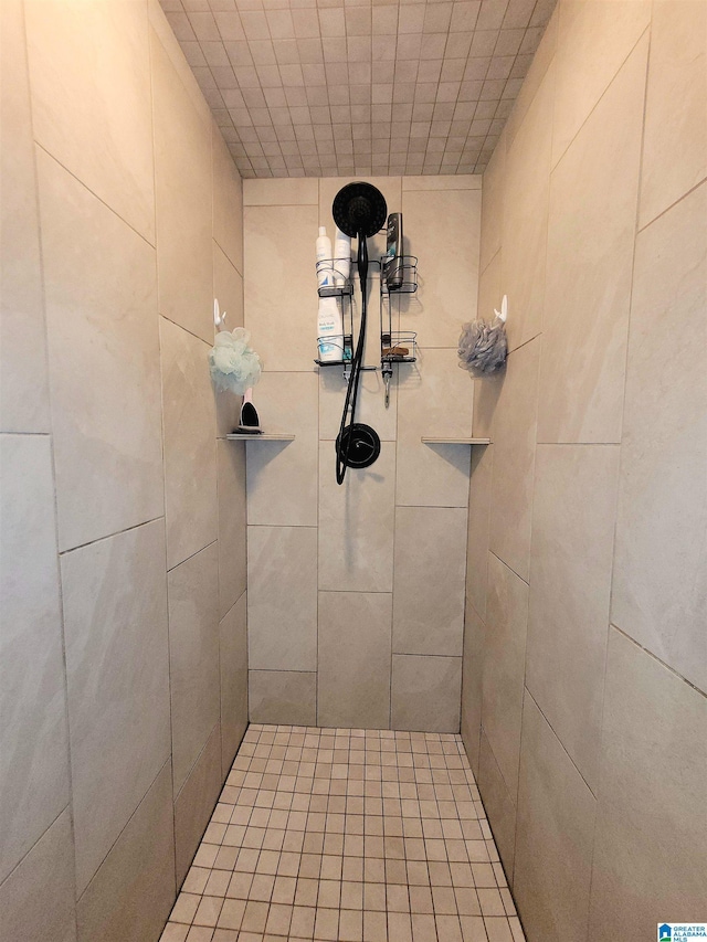 bathroom with tiled shower