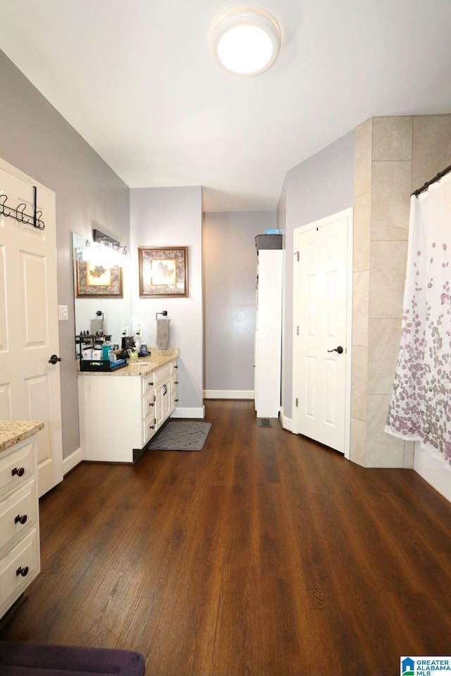 bathroom featuring vanity and wood-type flooring