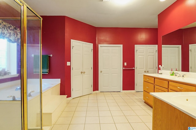 bathroom featuring vanity, independent shower and bath, and tile patterned floors