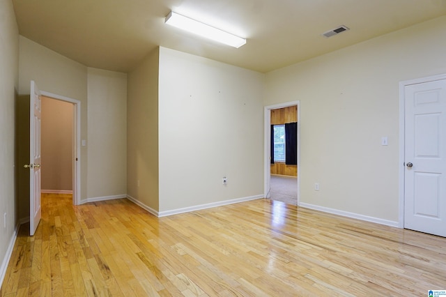 unfurnished room featuring light hardwood / wood-style floors