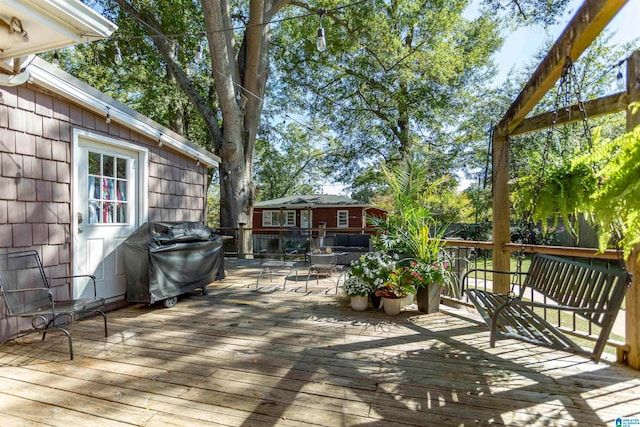 wooden deck featuring grilling area