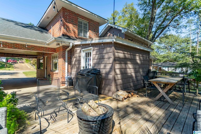 wooden deck featuring area for grilling