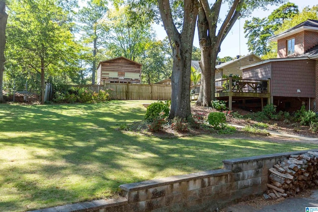 view of yard with a wooden deck