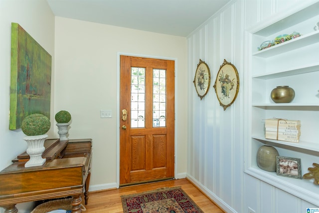 foyer entrance with light hardwood / wood-style flooring