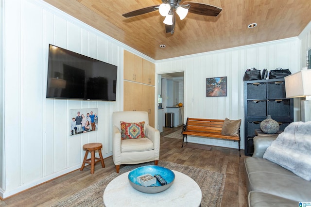 living room with wood walls, hardwood / wood-style floors, ceiling fan, and wooden ceiling