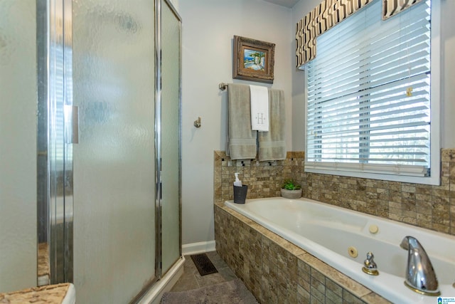 bathroom with shower with separate bathtub