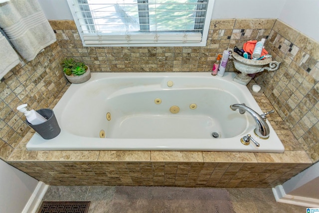 bathroom featuring tiled bath