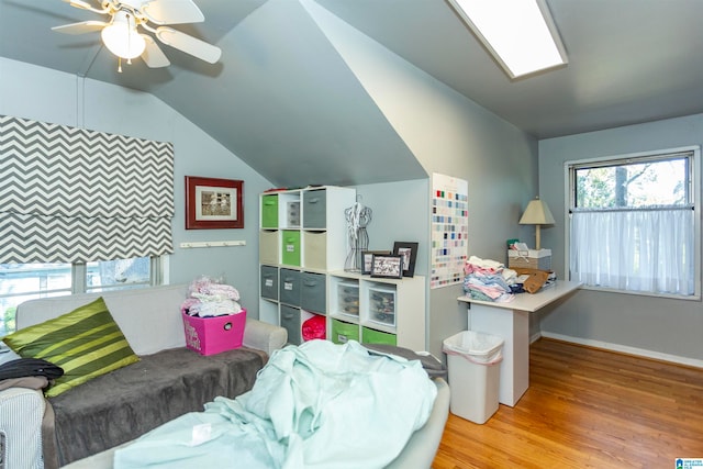 recreation room with lofted ceiling, light hardwood / wood-style flooring, and ceiling fan