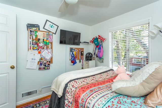 bedroom featuring hardwood / wood-style flooring and ceiling fan