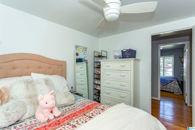 bedroom featuring dark hardwood / wood-style floors and ceiling fan