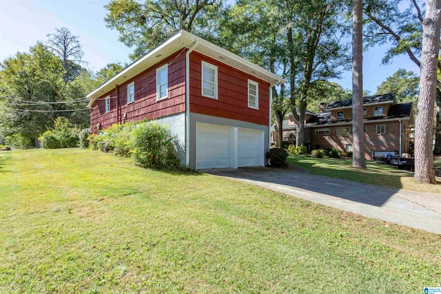 view of home's exterior featuring a yard and a garage