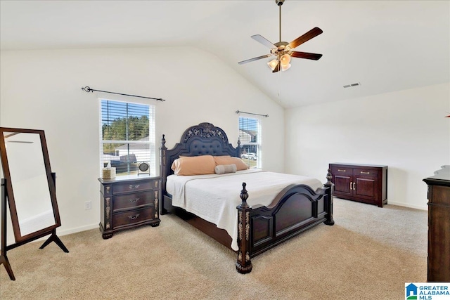 bedroom featuring light carpet, high vaulted ceiling, and ceiling fan