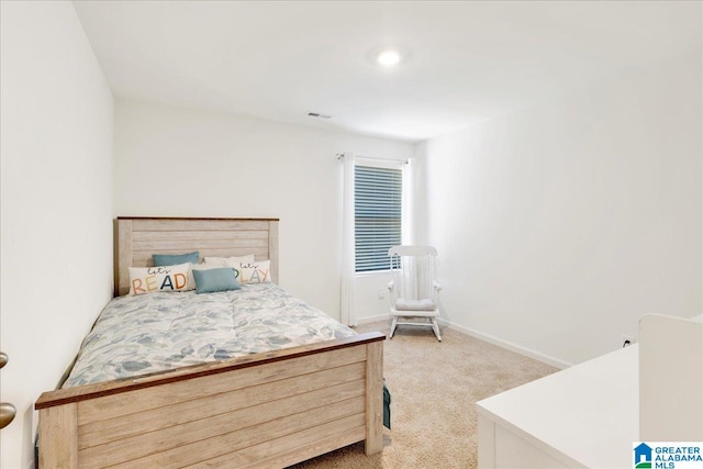 bedroom featuring light colored carpet