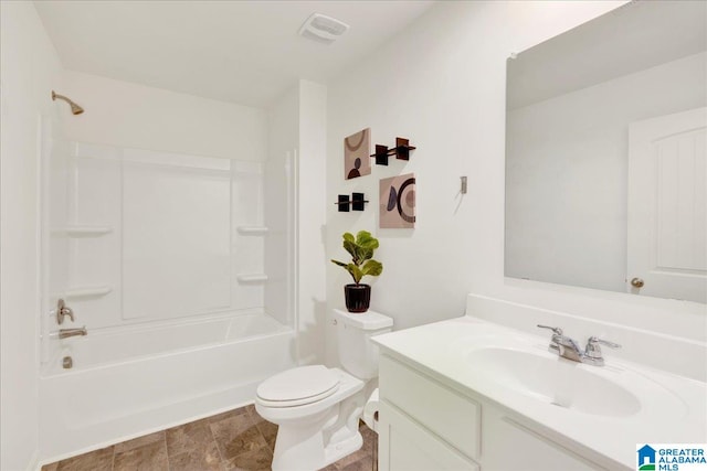 full bathroom with vanity, washtub / shower combination, and toilet