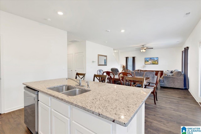 kitchen featuring a center island with sink, dark hardwood / wood-style flooring, white cabinetry, light stone countertops, and sink