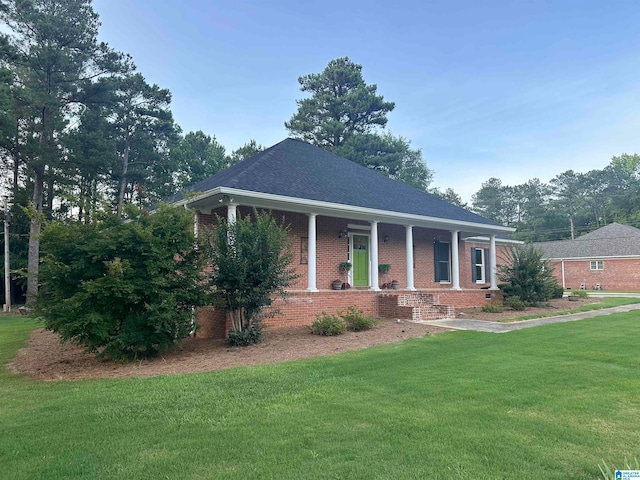 view of front facade with a front yard and a porch