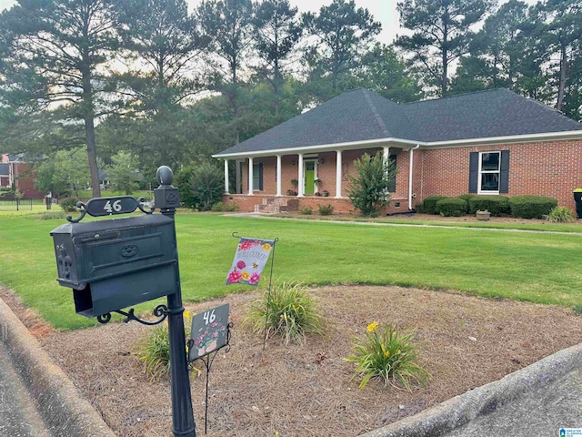 view of front facade with a porch and a front yard