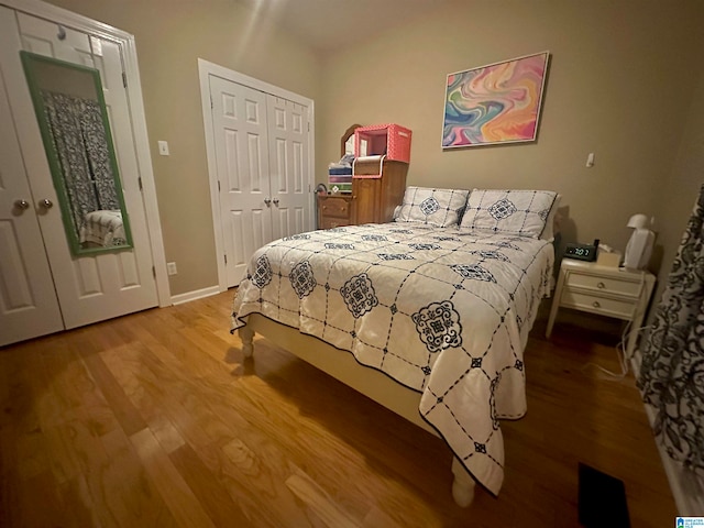 bedroom with hardwood / wood-style floors