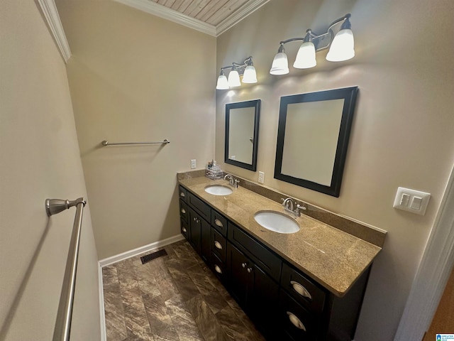 bathroom with crown molding and vanity