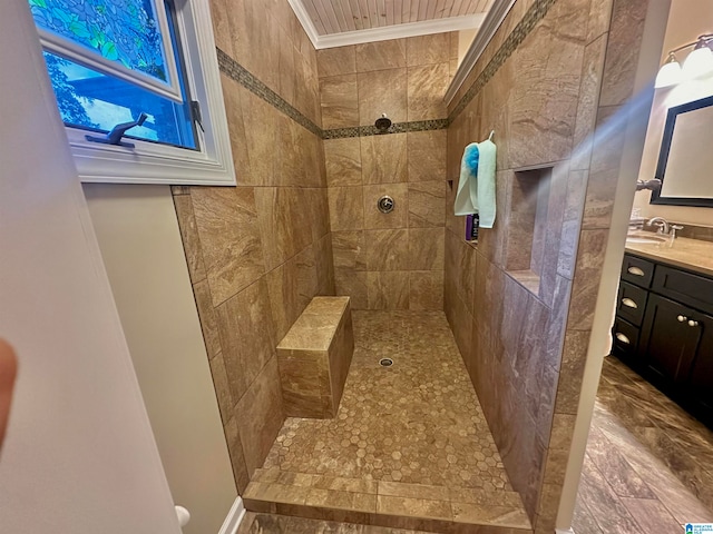 bathroom featuring vanity and tiled shower