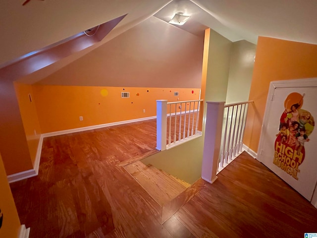 additional living space with lofted ceiling and wood-type flooring