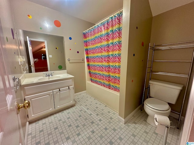 full bathroom with vanity, shower / bath combo with shower curtain, and toilet