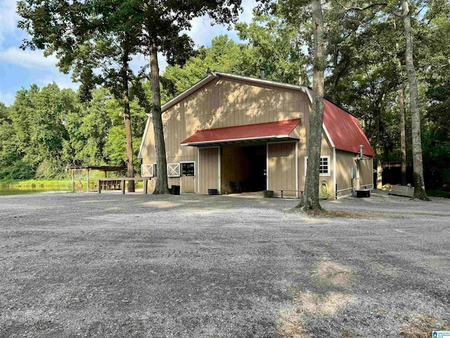 view of home's exterior featuring an outdoor structure