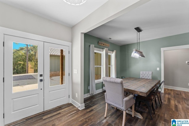 dining room with dark wood-type flooring and french doors