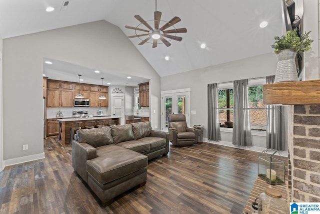 living room featuring high vaulted ceiling, dark wood-type flooring, and ceiling fan