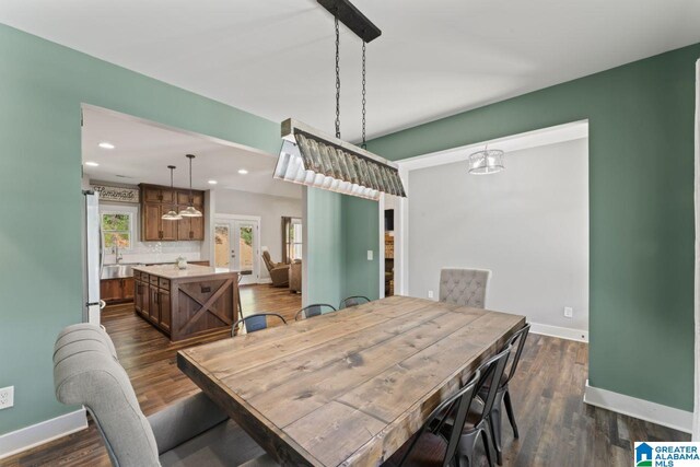 dining space featuring dark wood-type flooring and french doors