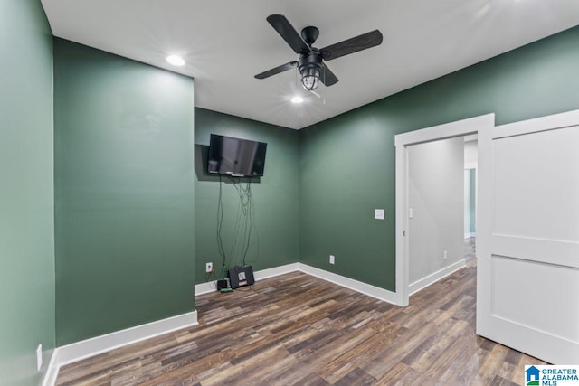 interior space featuring ceiling fan and dark hardwood / wood-style flooring