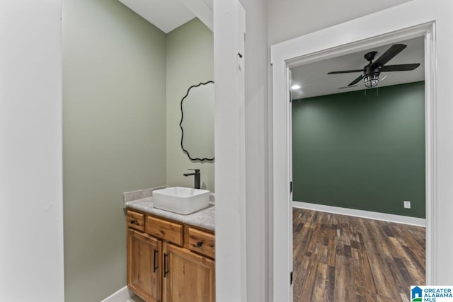 bathroom with vanity, wood-type flooring, and ceiling fan