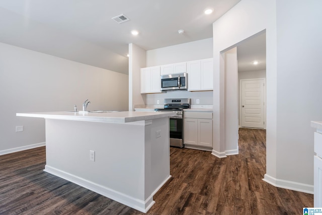 kitchen with sink, stainless steel appliances, dark hardwood / wood-style floors, an island with sink, and white cabinets