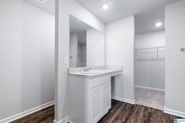 bathroom with wood-type flooring and vanity