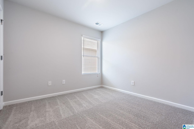 spare room featuring carpet flooring