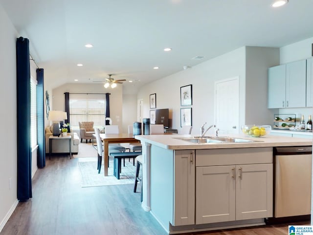 kitchen with light wood-type flooring, ceiling fan, sink, dishwasher, and white cabinetry