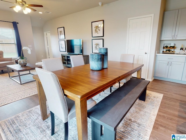 dining area featuring light hardwood / wood-style flooring and ceiling fan