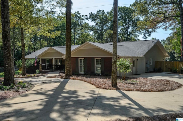 single story home with a porch