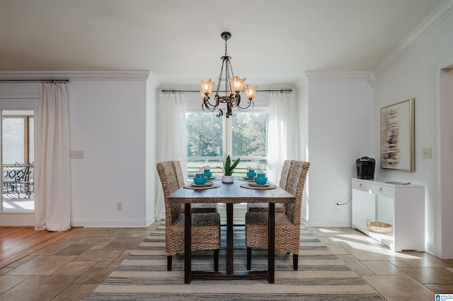 dining room featuring crown molding, wood-type flooring, and an inviting chandelier