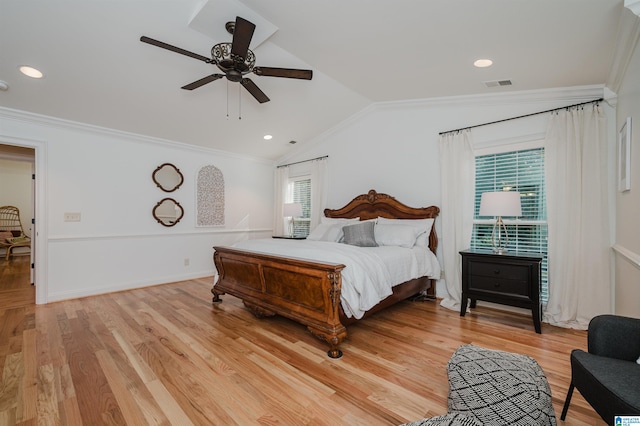 bedroom featuring ceiling fan, crown molding, lofted ceiling, and light hardwood / wood-style floors