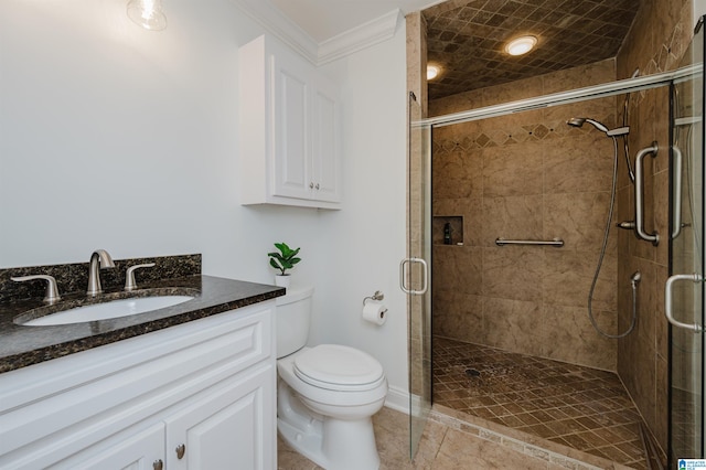 bathroom with a shower with door, toilet, tile patterned flooring, crown molding, and vanity