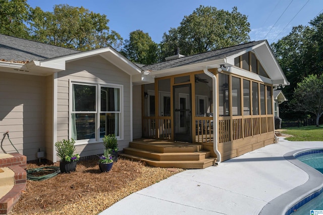 view of front facade with a sunroom