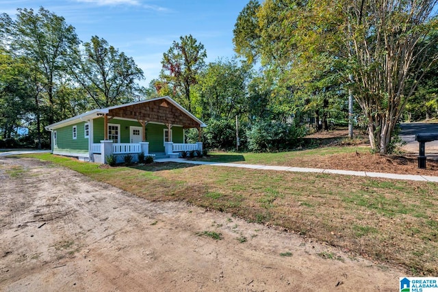 single story home with covered porch