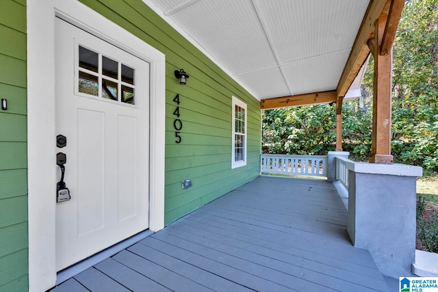 wooden terrace featuring a porch