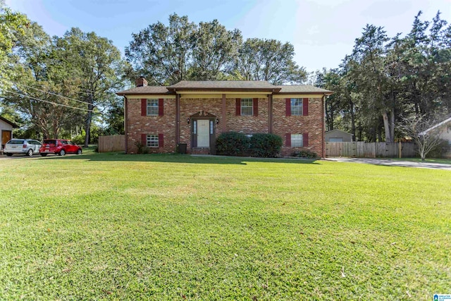 split foyer home featuring a front lawn