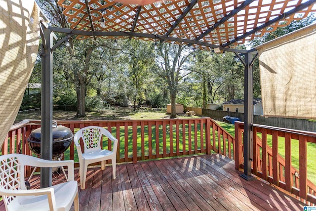 deck with a lawn and a pergola