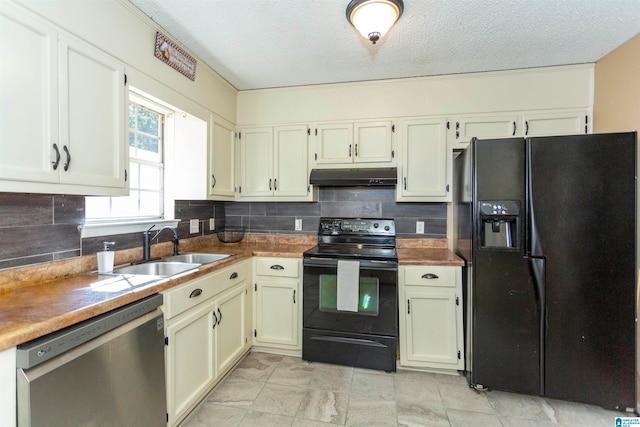 kitchen with sink, black appliances, a textured ceiling, and tasteful backsplash